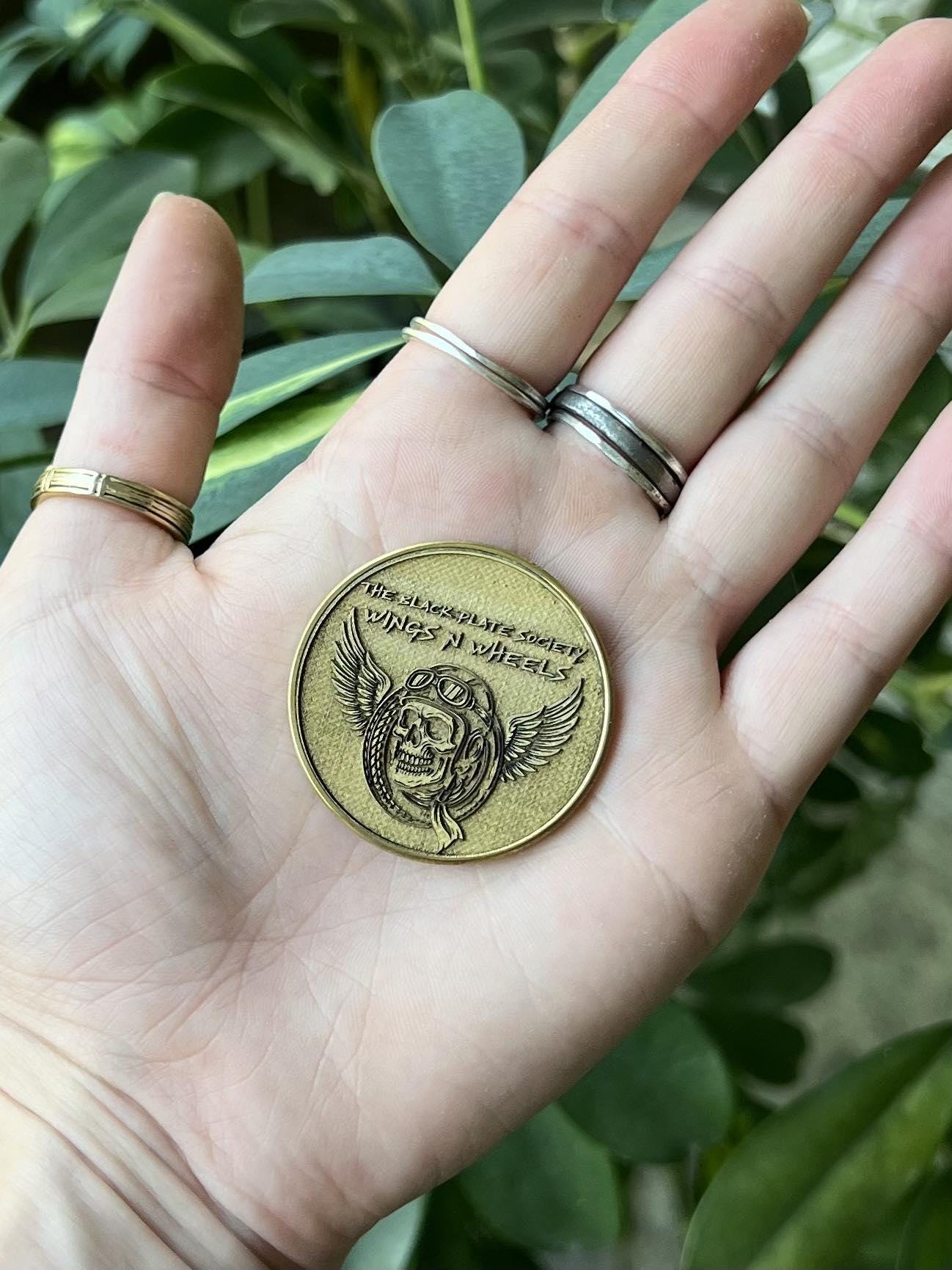 Brass Commemorative Coin – The Black Pate Society: Wings on Wheels